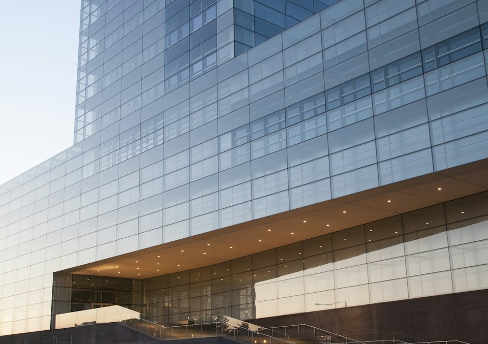 Glass facade of a modern commercial office building